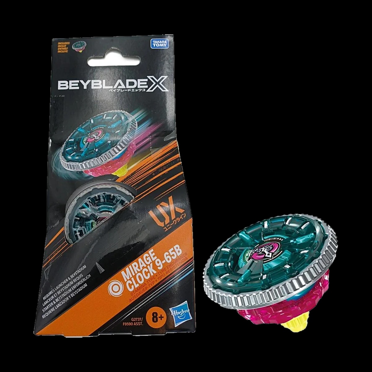 Confezione Beyblade X Mirage Clock 9-65B con la trottola verde acqua e rosa accanto